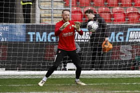 Viktor Johansson warms up before the Cardiff City game but there would be no start for the Rotherham United goalkeeper. Picture: Jim Brailsford