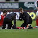 Rotherham United's Hamish Douglas receives treatment against Swindon Town. Picture: Jim Brailsford