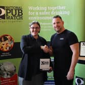 Accolade: Beth receives her award from Pubwatch sponsor Richard Smith