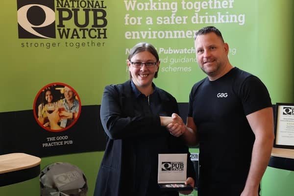 Accolade: Beth receives her award from Pubwatch sponsor Richard Smith