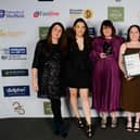 Communications team, charity team and Rhian Morris (far right) receive their award