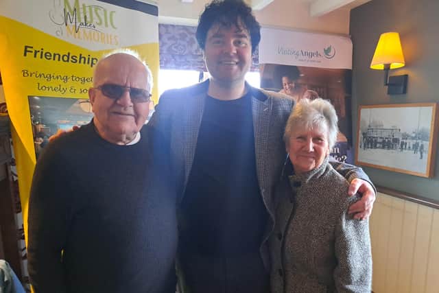 Ken and Sheila Charnock with performer Oliver Harris at a previous friendship lunch event
