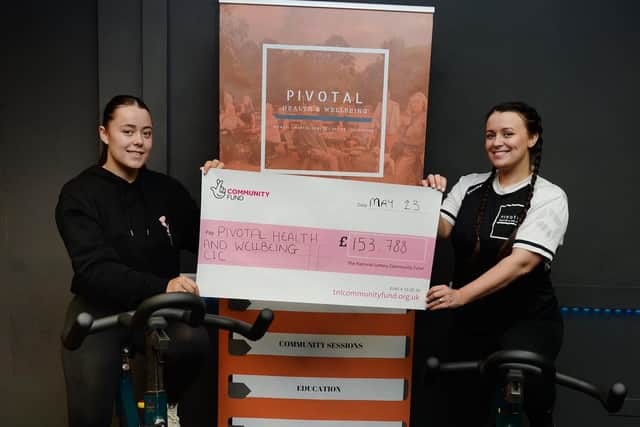 Pivotal Health & Wellbeing community sport and health officer Anne-Marie Newton (left) and lead project co-ordinator Abbey Clayton pictured with the lottery grant cheque for £153,788.00 (Photo - Kerrie Beddows)