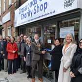 The Mayor of Rotherham Cllr Robert Taylor cut a ribbon to officially open the new Crossroads Care charity shop in the town centre, watched by Crossroads staff, volunteers, charity supporters and local dignitaries - photo by Kerrie Beddows