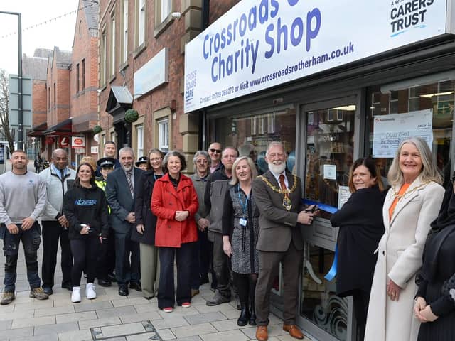 The Mayor of Rotherham Cllr Robert Taylor cut a ribbon to officially open the new Crossroads Care charity shop in the town centre, watched by Crossroads staff, volunteers, charity supporters and local dignitaries - photo by Kerrie Beddows