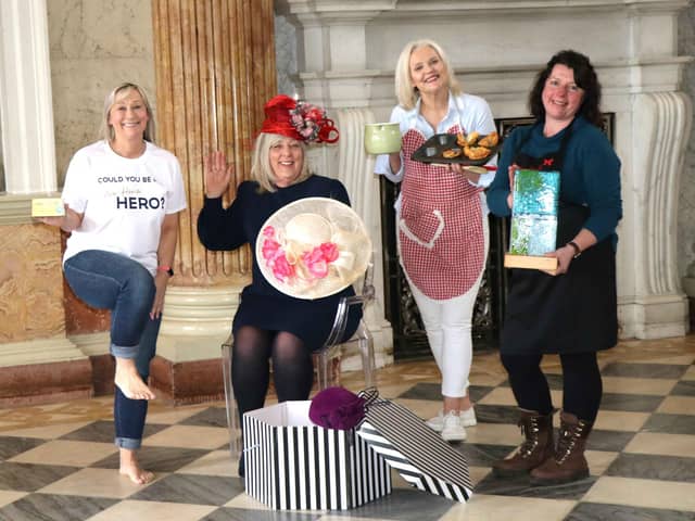 Fundraising manager Carole Foster, who will be doing a fire-walk, with hat designer Sherry Richardson, PR consultant Jo Davison and glass artist Pam Goodison