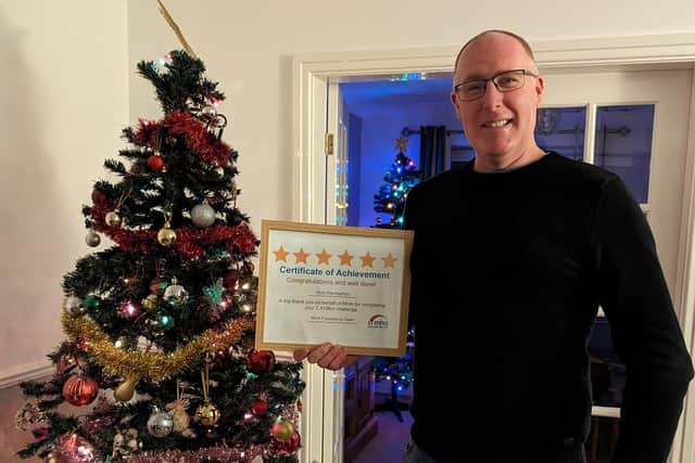 Rob Pemberton with his certificate from the nursing home