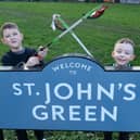 Litter picking youngsters at St John's Green Thomas Connelly (left) and Charlie Sharp - photo by Kerrie Beddows