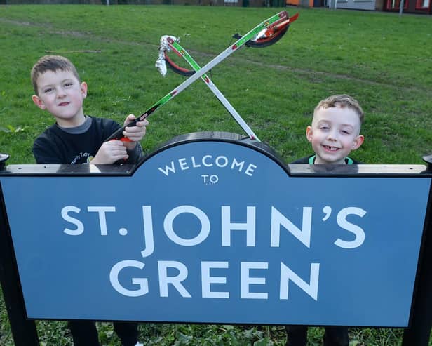Litter picking youngsters at St John's Green Thomas Connelly (left) and Charlie Sharp - photo by Kerrie Beddows