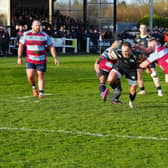 Rotherham Titans get to grips with a Leeds Tykes raider. Picture by MIKE INKLEY