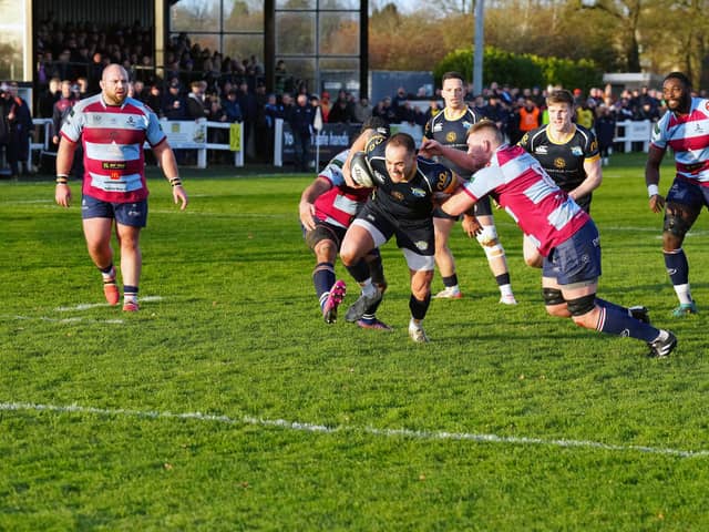 Rotherham Titans get to grips with a Leeds Tykes raider. Picture by MIKE INKLEY