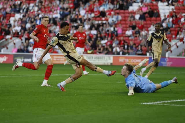 First-half chance: Shaun McWilliams goes close for Rotherham in the cup encounter with South Yorkshire rivals Barnsley.