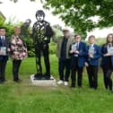 Artist Patrick Murphy pictured with his sculpture of Billy Casper and 'Kes' the kestrel, which was unveiled at Hoyland Common recently by students of Kirk Balk High School, in tribute to Barnsley novelist Barry Hines. Also pictured is councillor Sherry Holling.