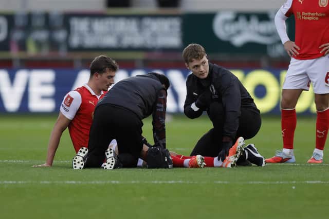 Rotherham United's Hamish Douglas has treatment before going off for Rotherham United against Swindon Town. Picture: Jim Brailsford