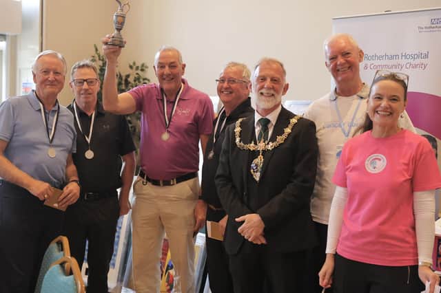 Paul Bottomley, Martin Lumb, Paul Gould and Paul Howard from team Hallows 2 with Martin Havenhand, former Chairman of The Rotherham NHS Foundation Trust, The Mayor of Rotherham, Councillor Robert Taylor, Steve Burns from Rotherham Cancer Care and Rachael Dawes, from Rotherham Hospital and Community Charity