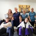 Greenside Court staff with residents and their accreditation
