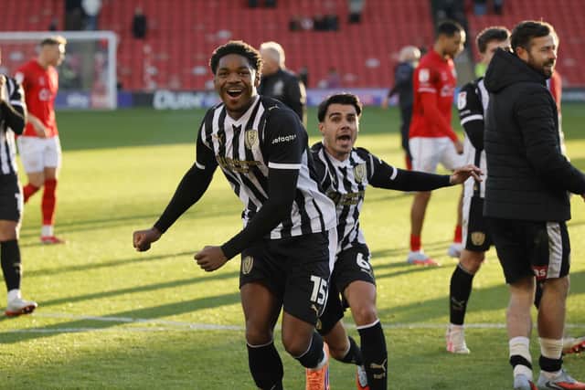 Victory smile: Jamal Baptiste celebrates after an historic win for the Millers.