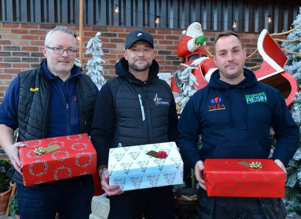 Christmas fundraising organiser Dean Whitehouse of DW Interiors (centre), with David Love of Chic Blinds (left) and Gavin Howley of Bespoke Resin, who have donated to the fundraiser to help South Yorkshire Street Angels. (Pic by Kerrie Beddows)