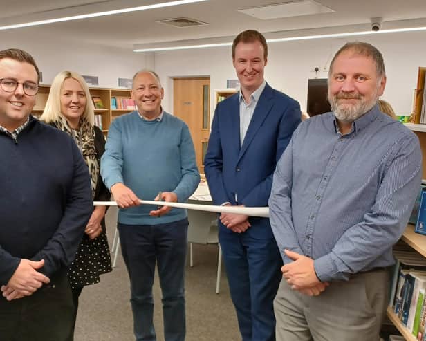 Cllr Brian Clark cuts the ribbon. Also pictured, from left: Thurcroft Parish Council clerk Tom Collingham, RMBC customer services manager Zoe Oxley, RMBC leader Cllr Chris Read and cabinet member Cllr David Sheppard