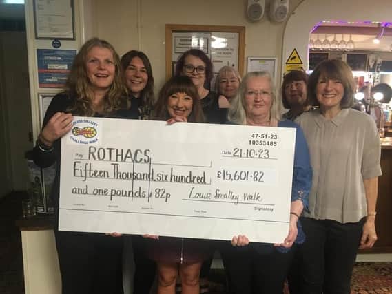The Rothacs team accepting the cheque: front (from left): Jo McKinney, Gaynor Smith, counsellor Liz Thompson, Dr Anne Cooper. Back: Katie Hale, senior counsellor Susan Coldwell, external supervisor Teresa Greaves, treasurer Laraine Bisby.