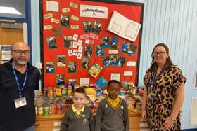 Paul  Senior from Swinton Lock Foodbank (left) and  Lauren Moore, inclusion lead at Brookfield (right) with two Brookfield Junior Academy pupils