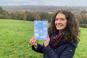 Josephine Dellows with her colouring book in Meersbrook Park in Sheffield