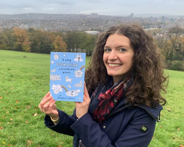 Josephine Dellows with her colouring book in Meersbrook Park in Sheffield
