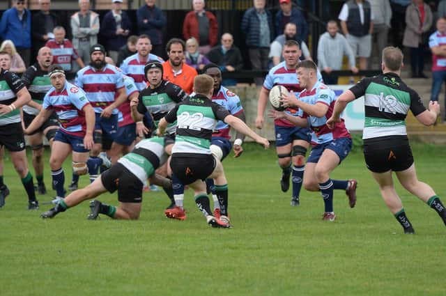Harry Dunne takes a pass in Rotherham Titans' victory over Lymm. Picture by KERRIE BEDDOWS