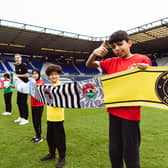 Kids with mega football scarf at Kellogg's Football Camps launch
