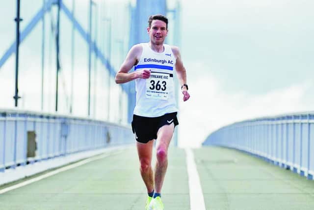 STRIDING OUT: Iain Whitaker crosses the Forth Road Bridge.
