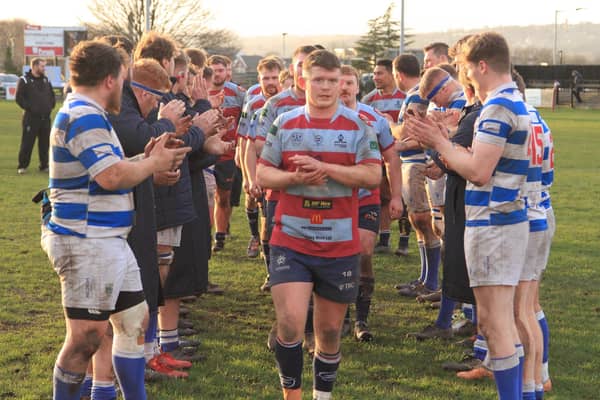 Harry Dunne leads the Titans team line after his 100th appearance for the club. Picture by GARETH SIDDONS