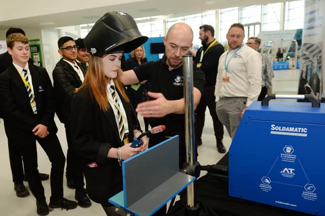 The University of Sheffield AMRC welcomed students from Rotherham to an event at it's Factory 2050 run by Make UK, as part of National Manufacturing Day. Year 11 Oakwood High School students had a go with an augmented reality welding simulation systemm, under the guidance of training centre business and development manager Marc Rhodes.
