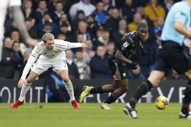 Rotherham United's Christ Tiehi moves the ball away from Leeds United's Patrick Bamford. Picture: Jim Brailsford