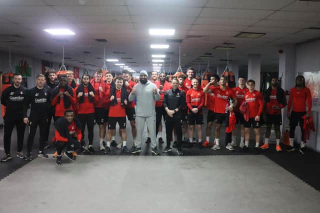 PUNCHING: Millers players line up with gym boss Abdul Majid