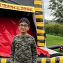FUN: Aarav of Whiston Worrygoose School with one of the inflatables he hired