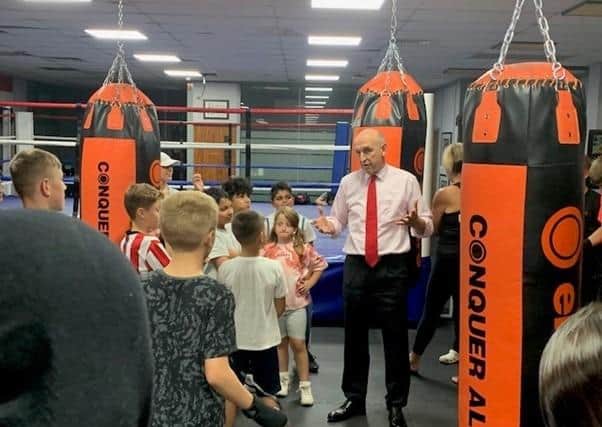 John Healey MP speaking with youngsters at Unity Gym