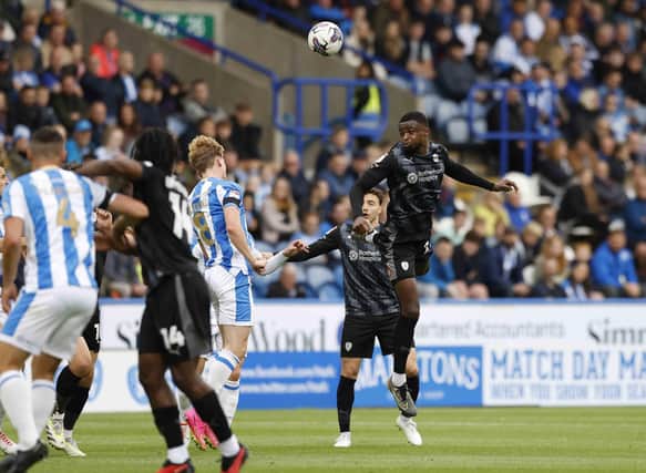 Hakeem Odoffin wins a first-half header for Rotherham United at Huddersfield Town in the Championship clash. Picture: Jim Brailsford