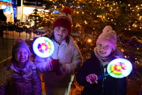 Enjoying the Mexborough Christmas lights switch on were, left to right: Ariella and Amelia Fuller and Nellie Rumble.