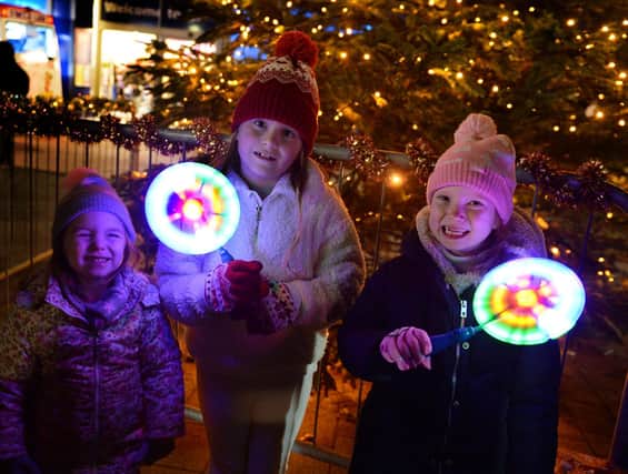 Enjoying the Mexborough Christmas lights switch on were, left to right: Ariella and Amelia Fuller and Nellie Rumble.