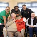 Rotherham United's Sebastian Revan and Ollie Rathbone visiting residents at Moorgate Croft Care Home, Rotherham (photo = Matt Roberts)
