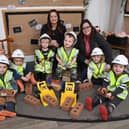 Lindsey Morgan (left), sales advisor at Jones Homes’ Lambcote Meadows development, alongside Lisa Greensmith from Lime Tree Nursery with some of the children enjoying the new toys
