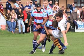 Hard-tackling action from Rotherham Titans' win over Huddersfield last weekend. Picture by GARETH SIDDONS