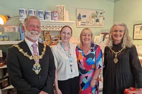The Mayor of Rotherham Cllr Robert Taylor, Rotherham Hospice fundraising manager Sophie Barnett, retail manager Theresa Cropper, and Mayoress Tracy Taylor