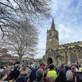 Tradition: Crowds gathered at Wath Parish Church for the traditional bun throwing from the top of the church, which took place as the clock struck 12 noon on Saturday during Wath Festival