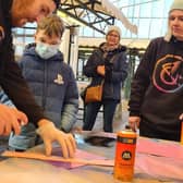 Young people involved with Big History, Bright Future take part in a graffiti workshop at Rotherham's Uplift Skate and Art Festival (Photo: Art of Protest)