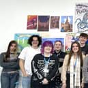 Some of the college students with their art