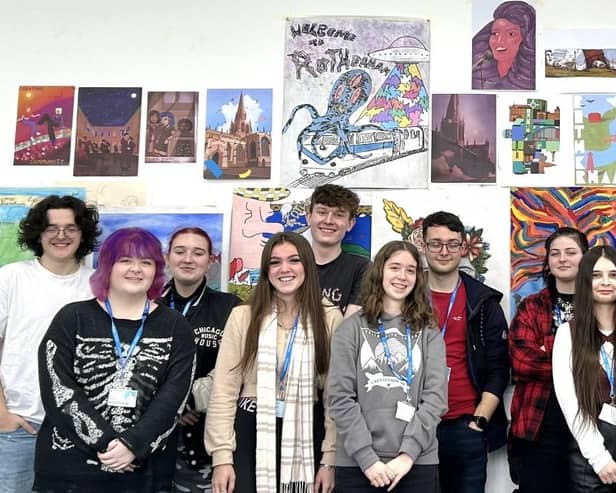 Some of the college students with their art