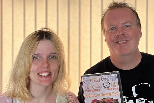DVD: Rebecca and Dean with the DVD of A Dollar To Die For
