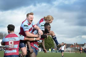 John Okafor is mobbed after his match-clinching late score against Leeds Tykes. Pictures by KERRIE BEDDOWS