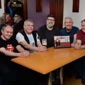 Silverwood Miners Welfare Club's 'Prostate Corner' with their new artwork. From left to right are: Martin Tune, Shaun Garratty, artist Steve White, Alan Tunstill, Chris Caldwell and Martyn Frith.
